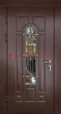 Темная железная дверь со стеклом и ковкой для частного дома ДСК-156 в Уфе