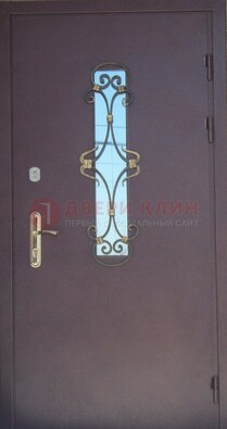 Металлическая дверь со стеклом и ковкой ДСК-77 в Уфе